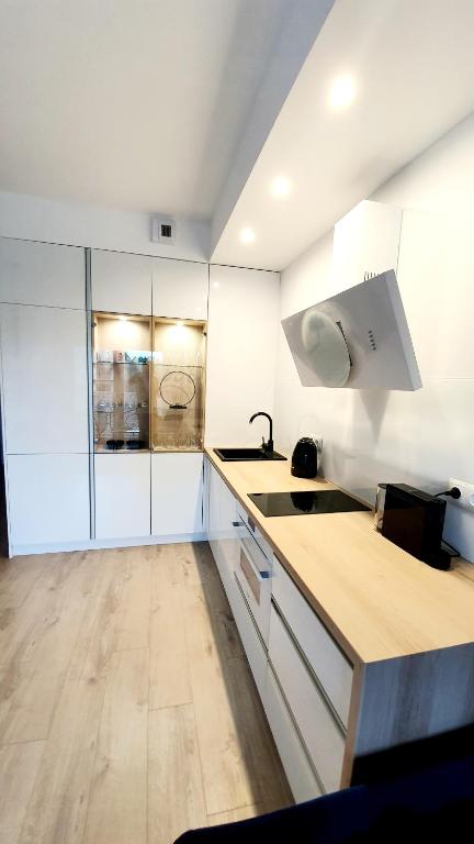 Kuchyň nebo kuchyňský kout v ubytování Apartament SONIA SAUNA-TARGI-GARAŻ