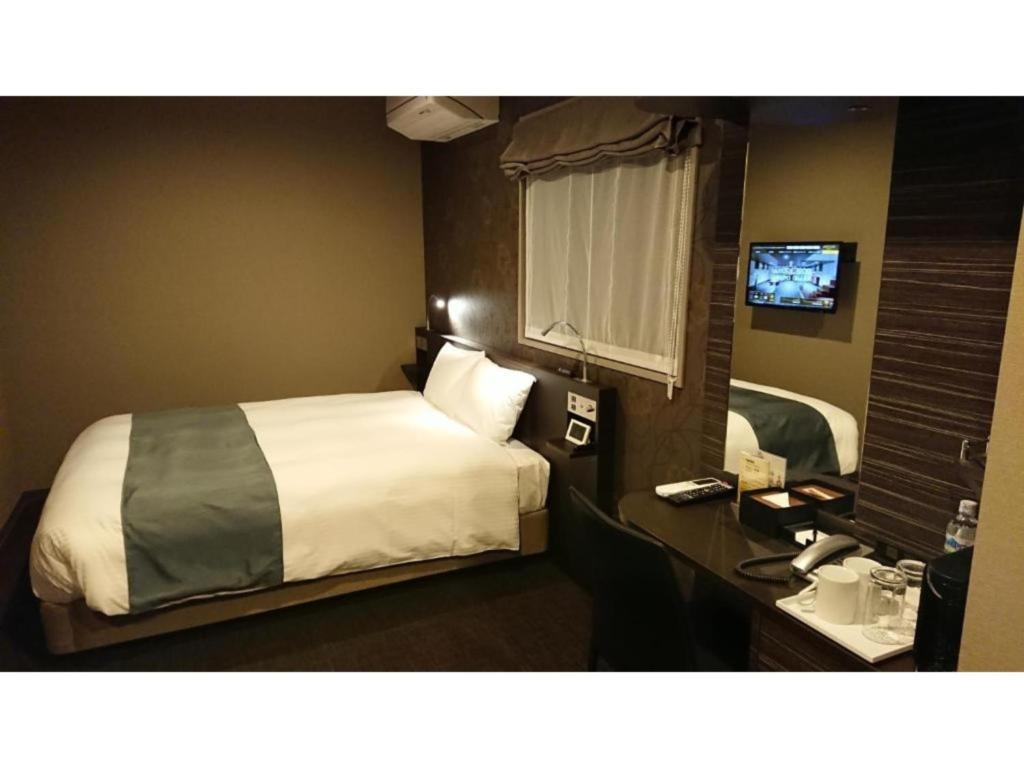 En eller flere senge i et værelse på Act Hotel Roppongi - Vacation STAY 85363