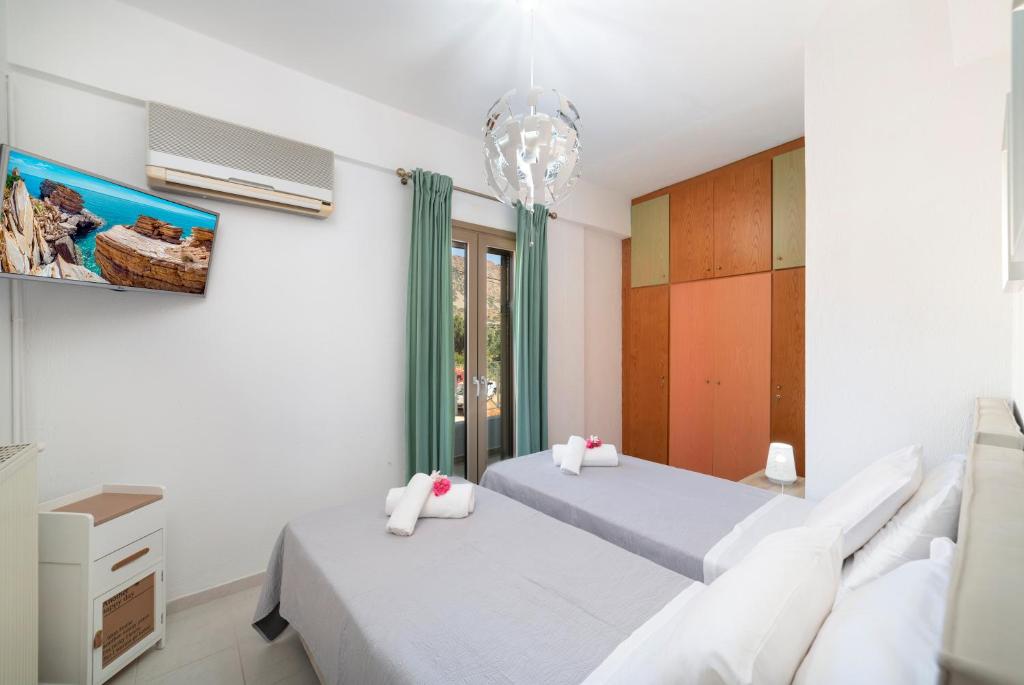 Posteľ alebo postele v izbe v ubytovaní Tsifliki Beach House