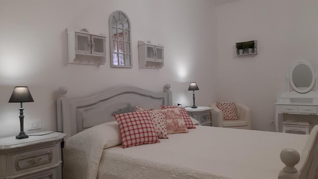Łóżko lub łóżka w pokoju w obiekcie Agriturismo Corte degli Angeli