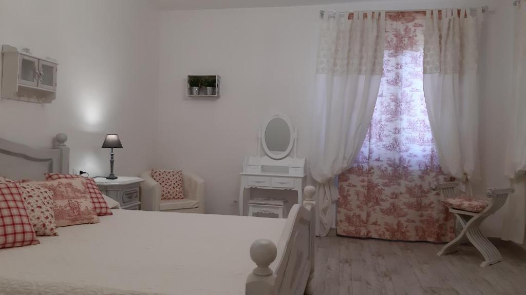 Łóżko lub łóżka w pokoju w obiekcie Agriturismo Corte degli Angeli
