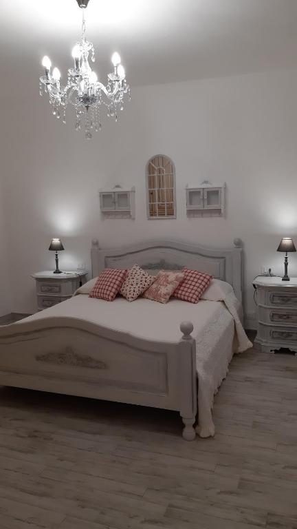 Łóżko lub łóżka w pokoju w obiekcie Agriturismo Corte degli Angeli
