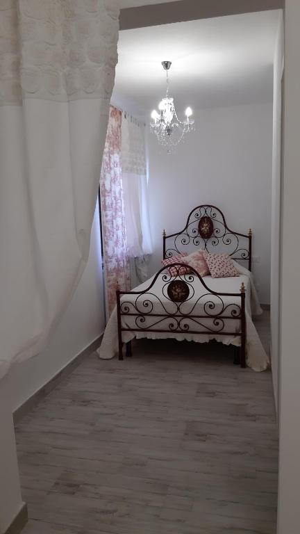Łóżko lub łóżka w pokoju w obiekcie Agriturismo Corte degli Angeli