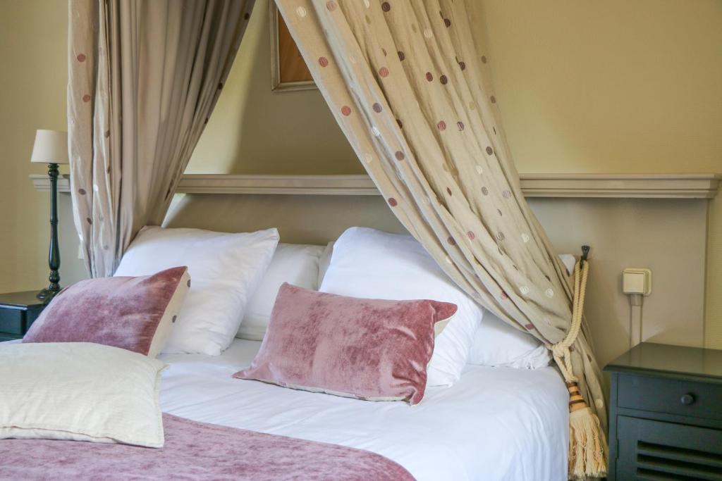 Postel nebo postele na pokoji v ubytování Auberge de Campveerse Toren