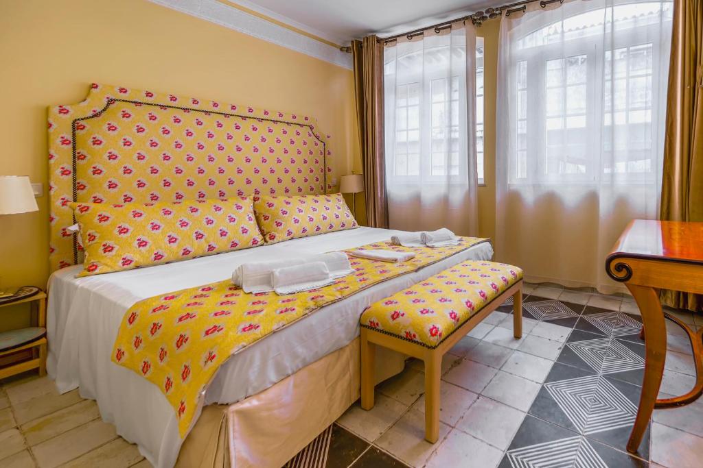 Postel nebo postele na pokoji v ubytování Mosaiko 5 Suites
