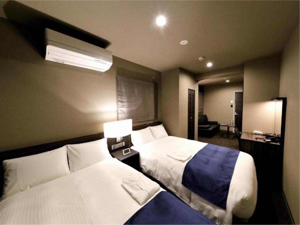 a hotel room with two beds in a room at Act Hotel Roppongi - Vacation STAY 85367 in Tokyo
