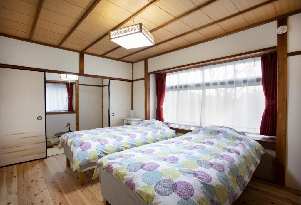 A bed or beds in a room at Kameoka - House - Vacation STAY 84269
