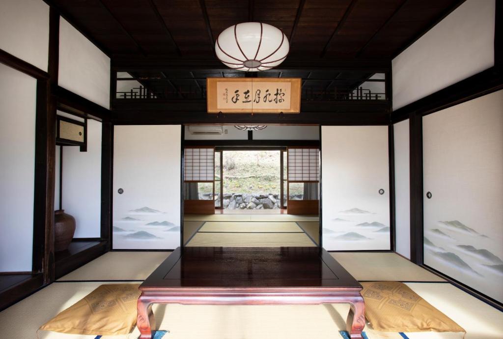 a room with glass doors and a chandelier at Kameoka - House - Vacation STAY 84233 in Kameoka