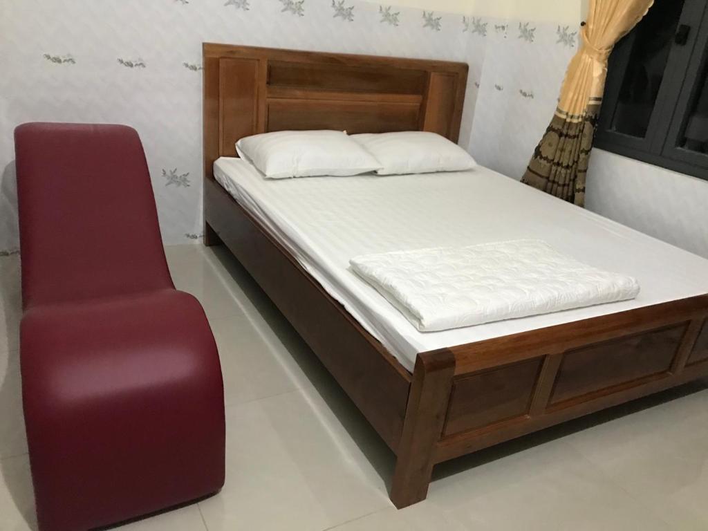Postel nebo postele na pokoji v ubytování Nhà Nghỉ An Phát