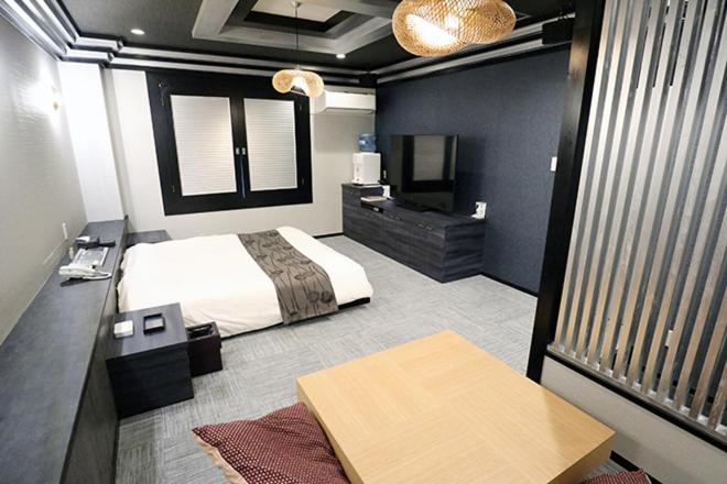 Postel nebo postele na pokoji v ubytování ホテルレックス諏訪 -レジャーホテル -
