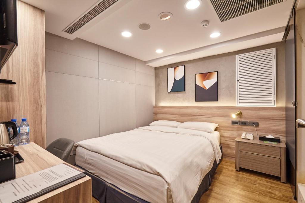 Postel nebo postele na pokoji v ubytování RF Hotel - Zhongxiao