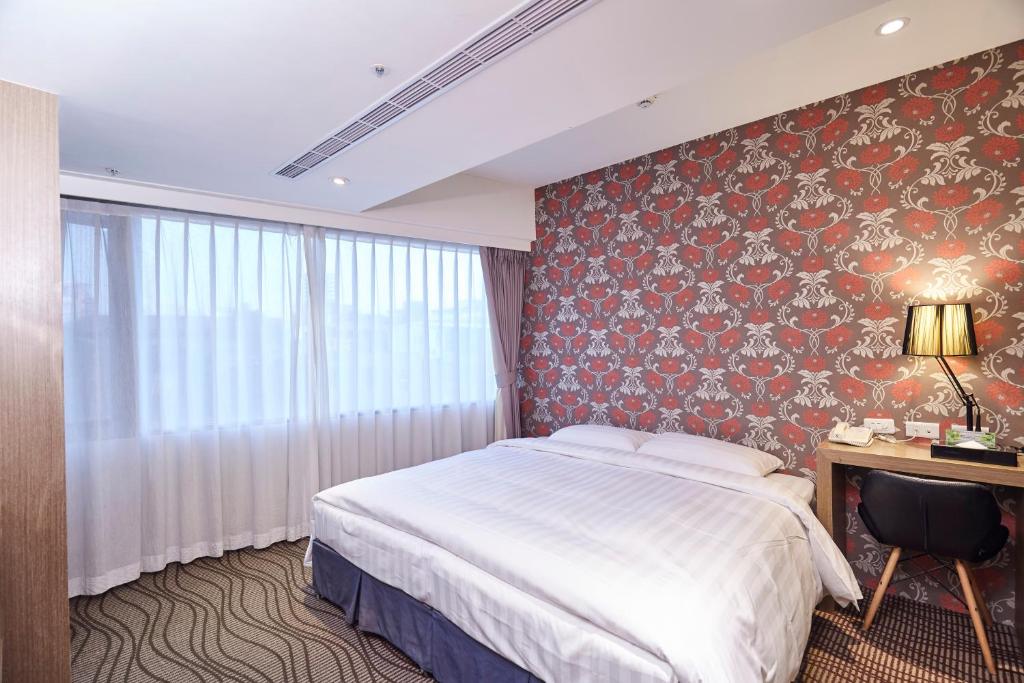 Postel nebo postele na pokoji v ubytování RF Hotel - Zhongxiao