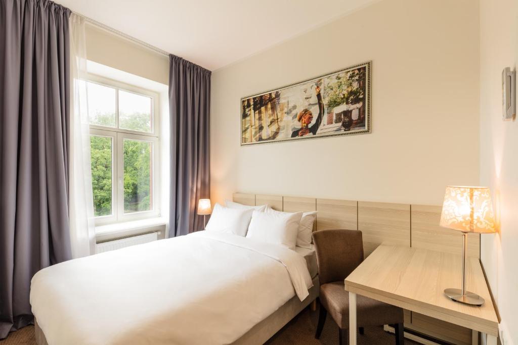 Postel nebo postele na pokoji v ubytování Radisson Hotel Old Town Riga