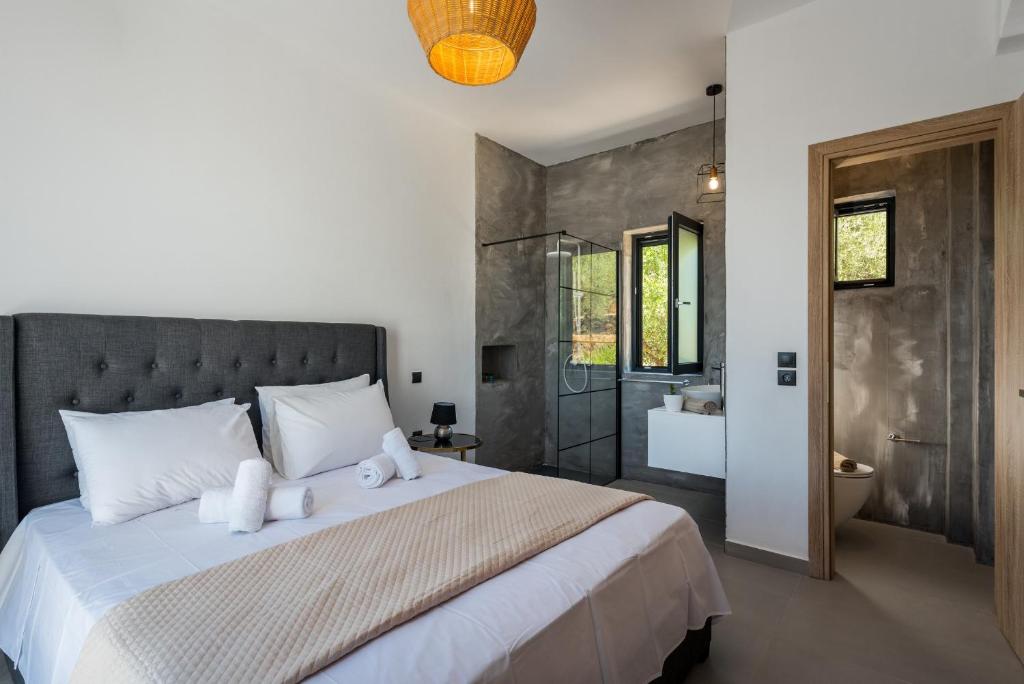 A bed or beds in a room at Queen of Zakynthos Luxury Villas