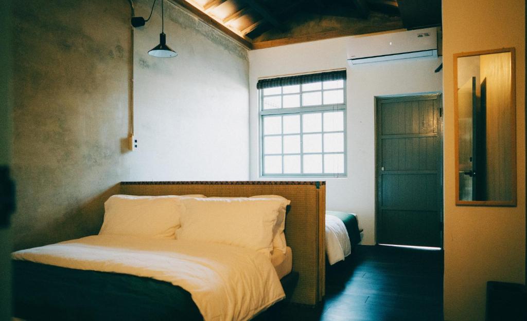 Postel nebo postele na pokoji v ubytování Goonnight Hostel