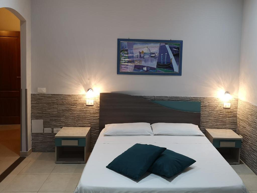 Postel nebo postele na pokoji v ubytování B&B AMURI RANNI