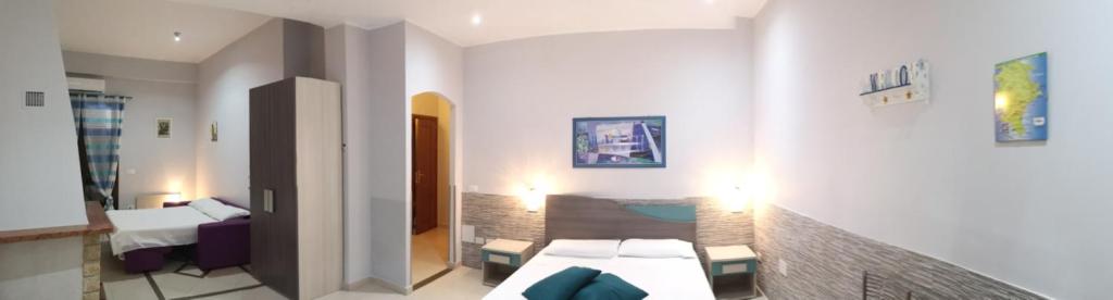 Postel nebo postele na pokoji v ubytování B&B AMURI RANNI