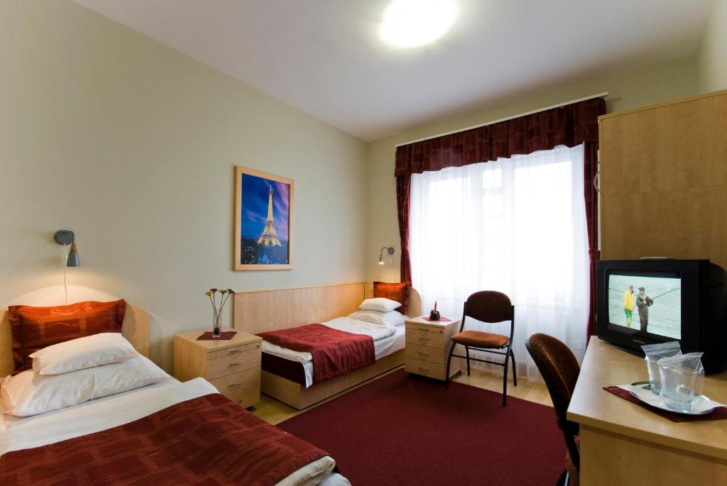 Voodi või voodid majutusasutuse Hotel Kerpely toas