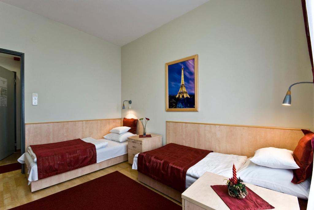 Voodi või voodid majutusasutuse Hotel Kerpely toas