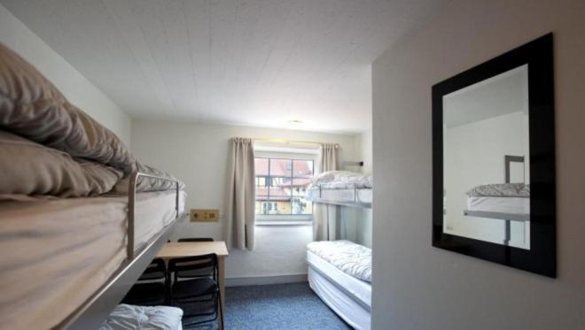 Postel nebo postele na pokoji v ubytování Danhostel Frederikshavn City