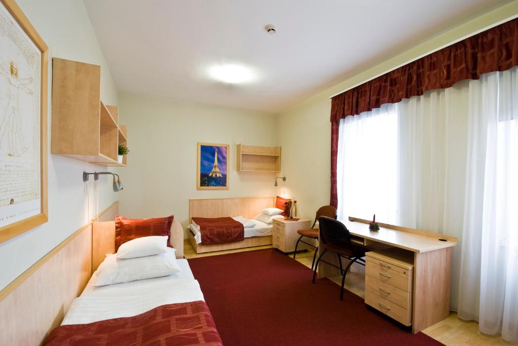 Voodi või voodid majutusasutuse Hotel Kerpely toas