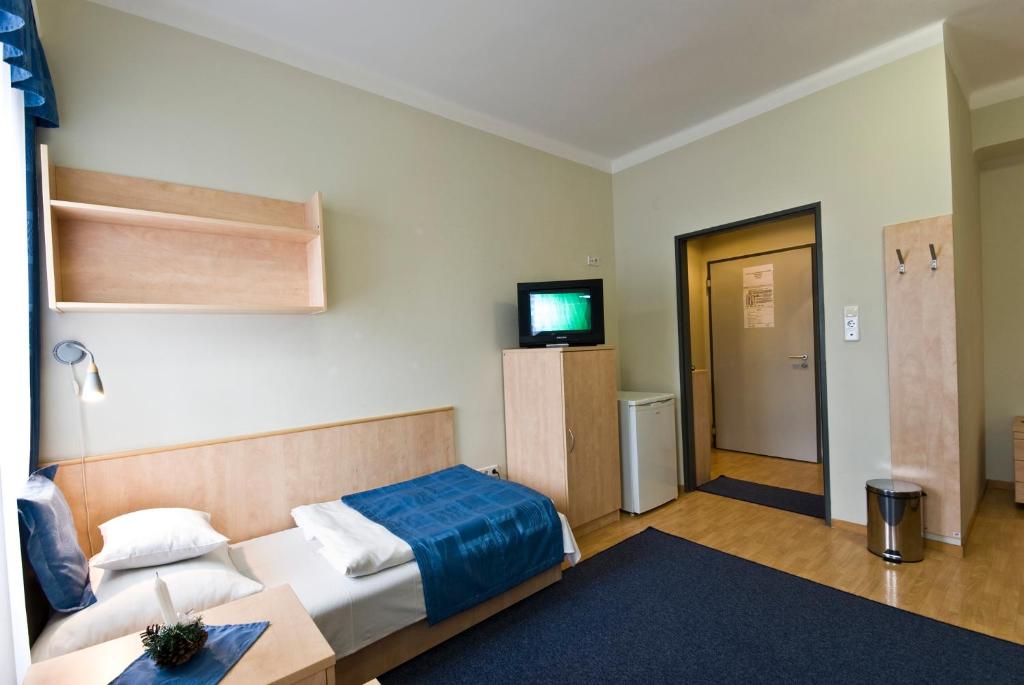 Voodi või voodid majutusasutuse Hotel Kerpely toas