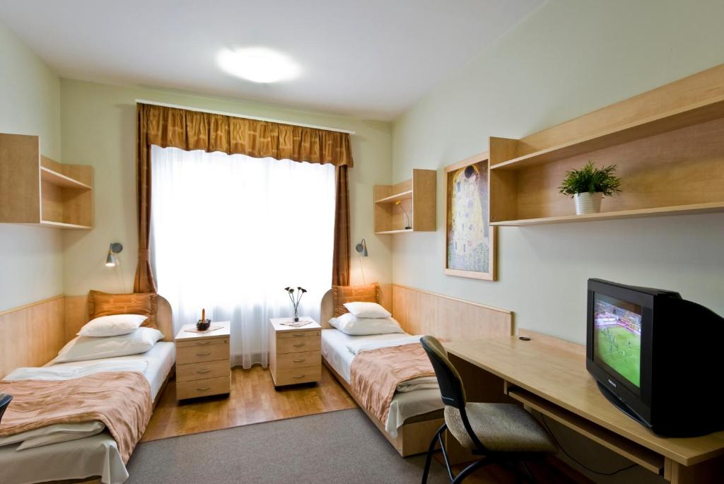 Voodi või voodid majutusasutuse Hotel Kerpely toas