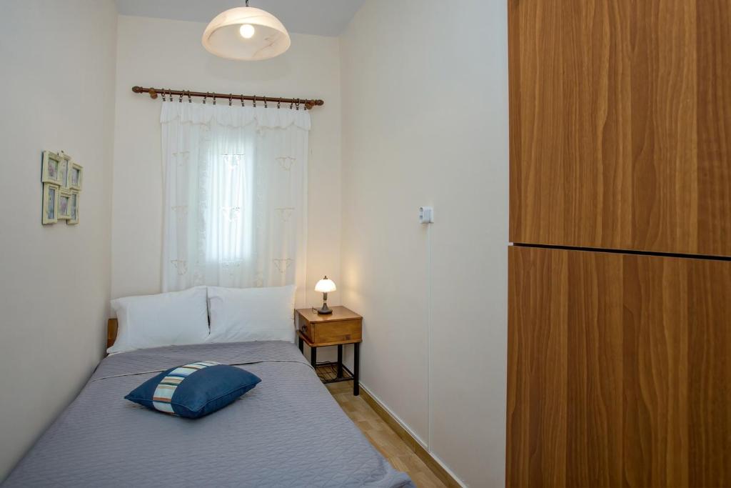 Postel nebo postele na pokoji v ubytování Xατζηράδος
