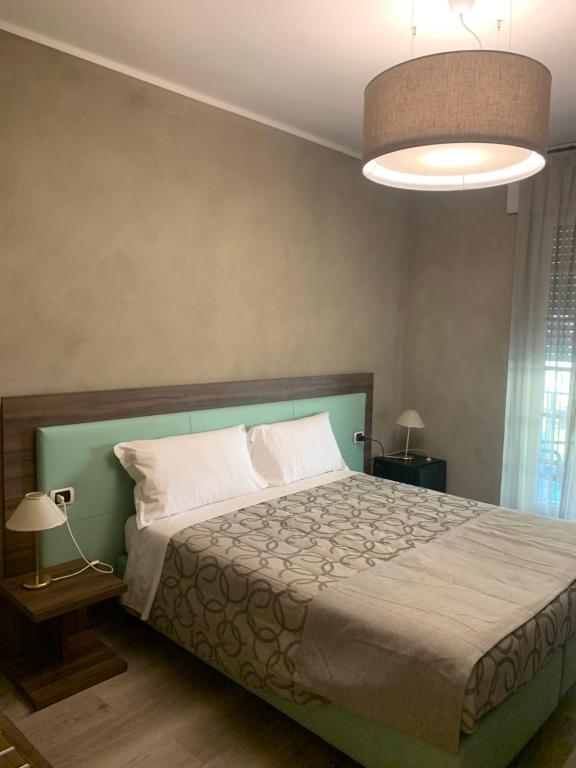 Postel nebo postele na pokoji v ubytování Hotel Conca D'Oro ***S