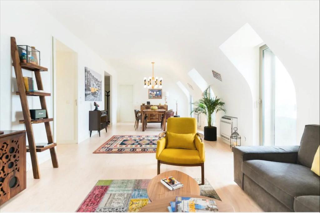 a living room with a couch and a table at Luxury Apartment by MyPlaceForYou, very quiet, close to Time Out Market Lisbon in Lisbon