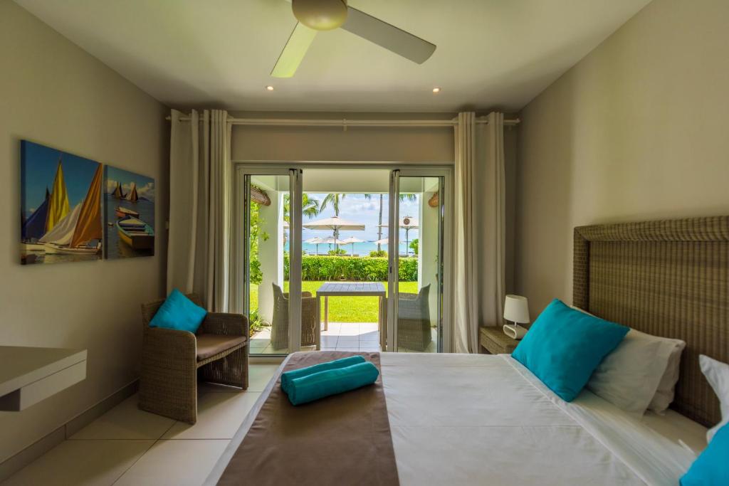Кровать или кровати в номере Mon Choisy Beach R.
