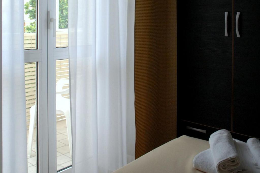 Postel nebo postele na pokoji v ubytování Hotel Arno