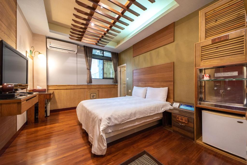 Postel nebo postele na pokoji v ubytování Shankou Hotspring Hotel