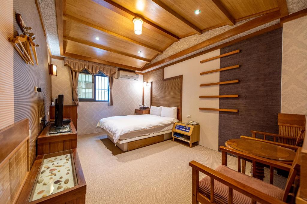 Postel nebo postele na pokoji v ubytování Shankou Hotspring Hotel