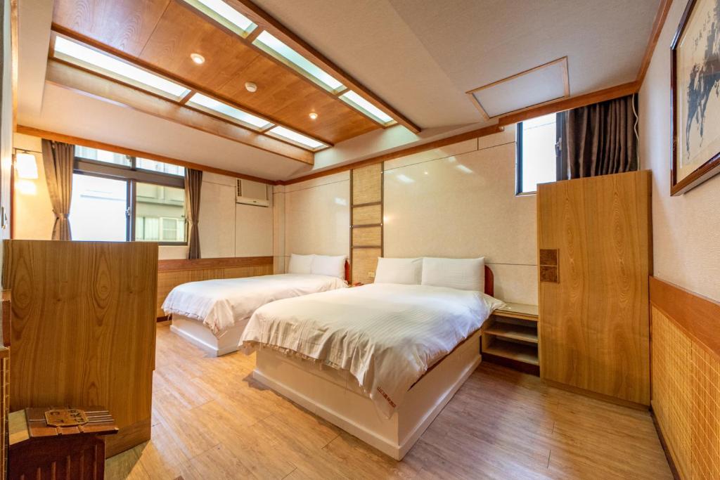 Postel nebo postele na pokoji v ubytování Shankou Hotspring Hotel