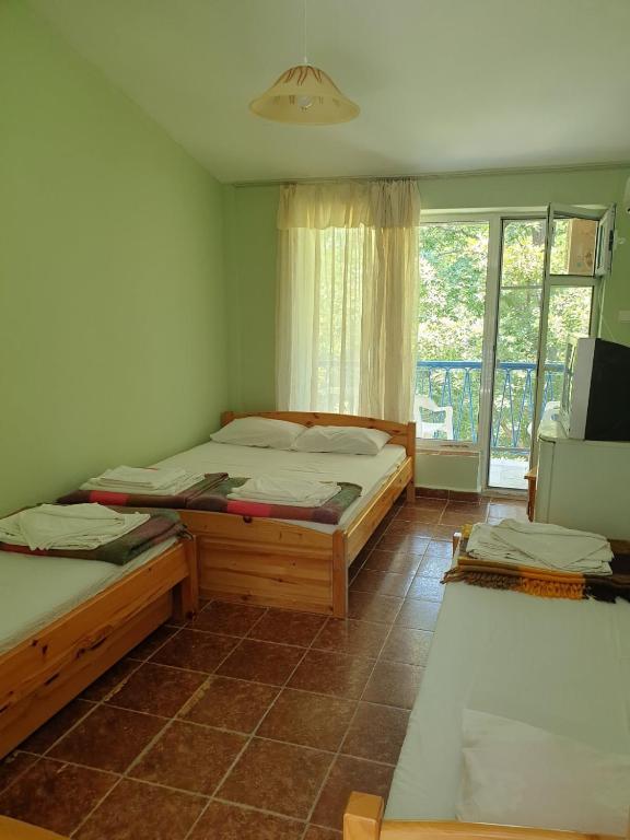 Postel nebo postele na pokoji v ubytování Hotel Maria