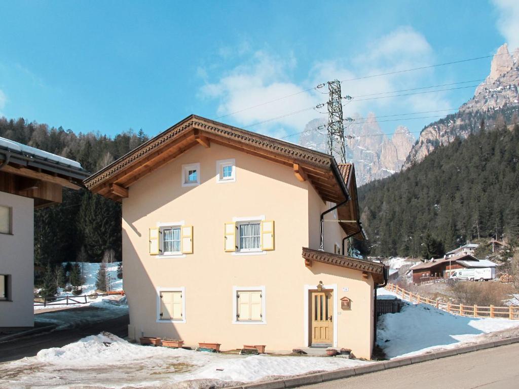 a house in the mountains with snow on the ground at Apartment Giuditta by Interhome in Pera