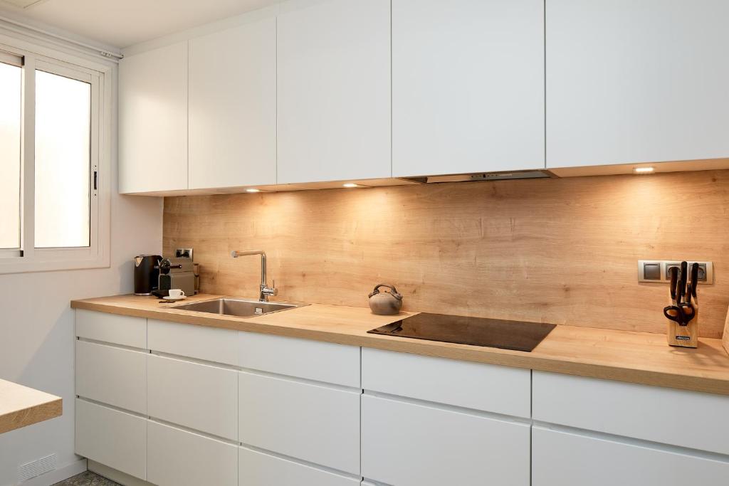 Kuchyňa alebo kuchynka v ubytovaní Quartprimera Apartments