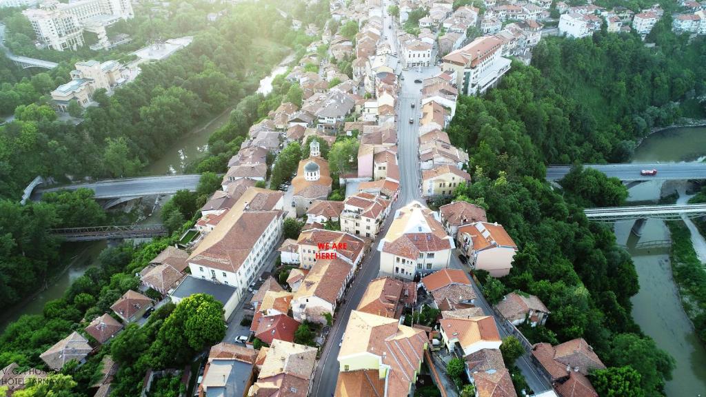 an aerial view of a town with houses and a river at Tarnava - Oldtown House in Veliko Tŭrnovo
