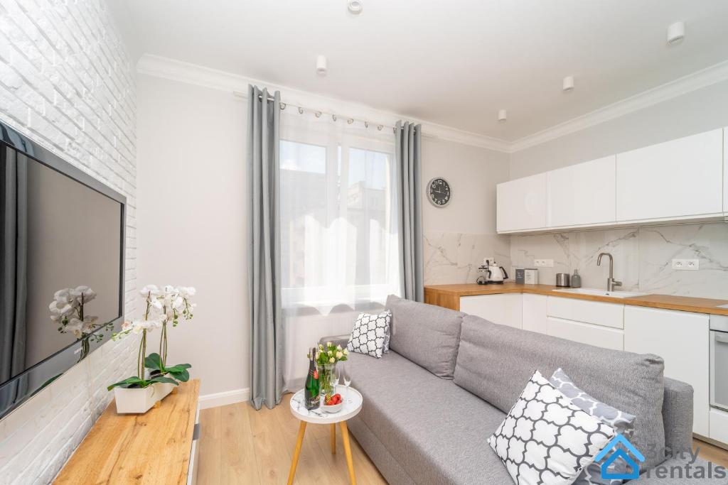 Kuchyňa alebo kuchynka v ubytovaní Nowoczesny Apartament 3city w Gdyni z Parkingiem by Noclegi Renters