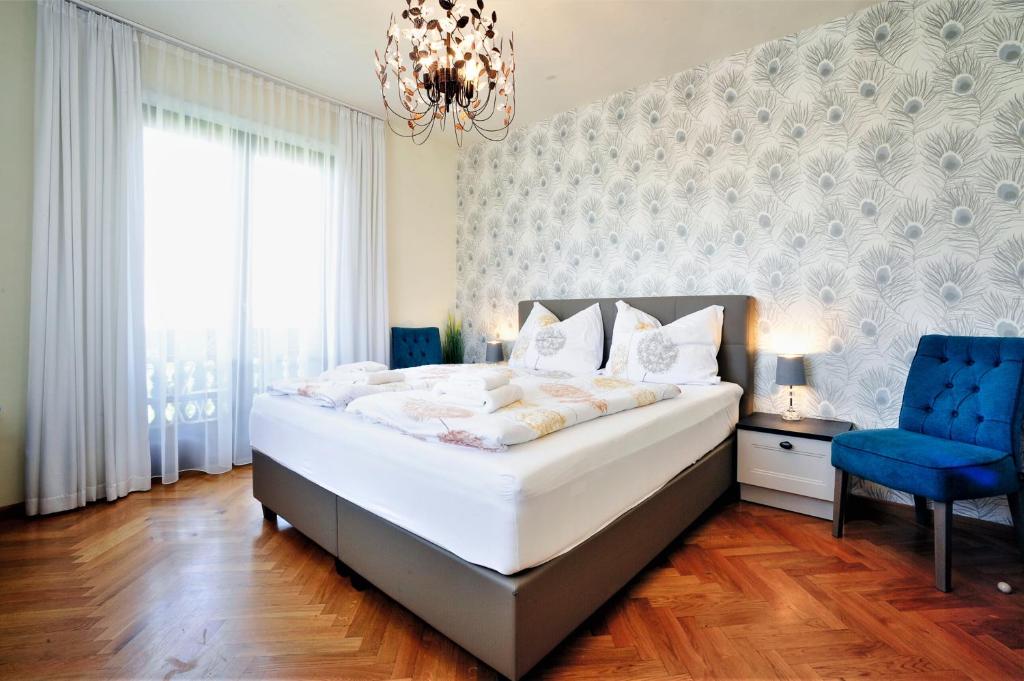 Кровать или кровати в номере MARTINIHOF - Bad Tatzmannsdorf