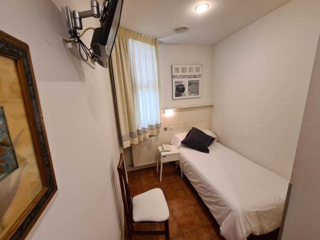 Postel nebo postele na pokoji v ubytování Hotel Jacobeo