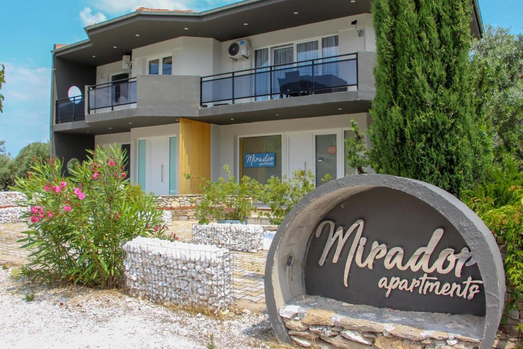 a house with a sign in front of it at Mirador Apartments in Limenas
