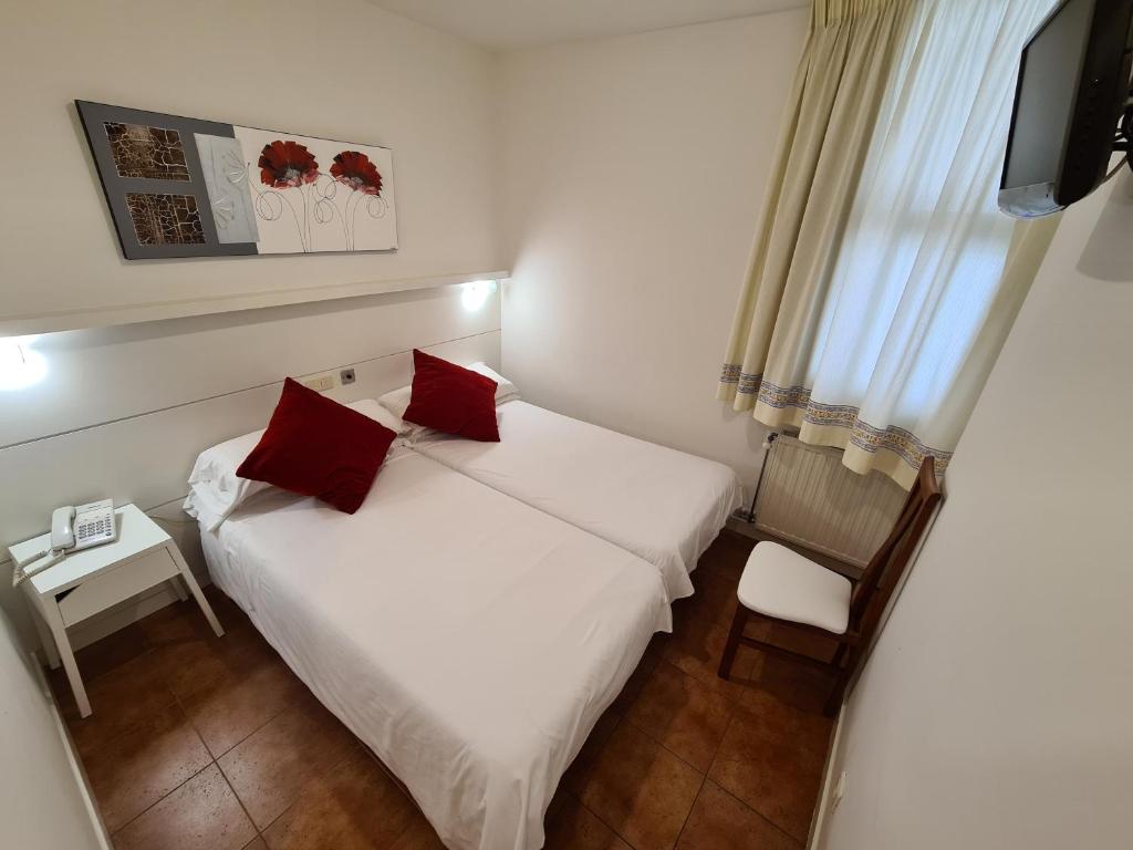 Postel nebo postele na pokoji v ubytování Hotel Jacobeo