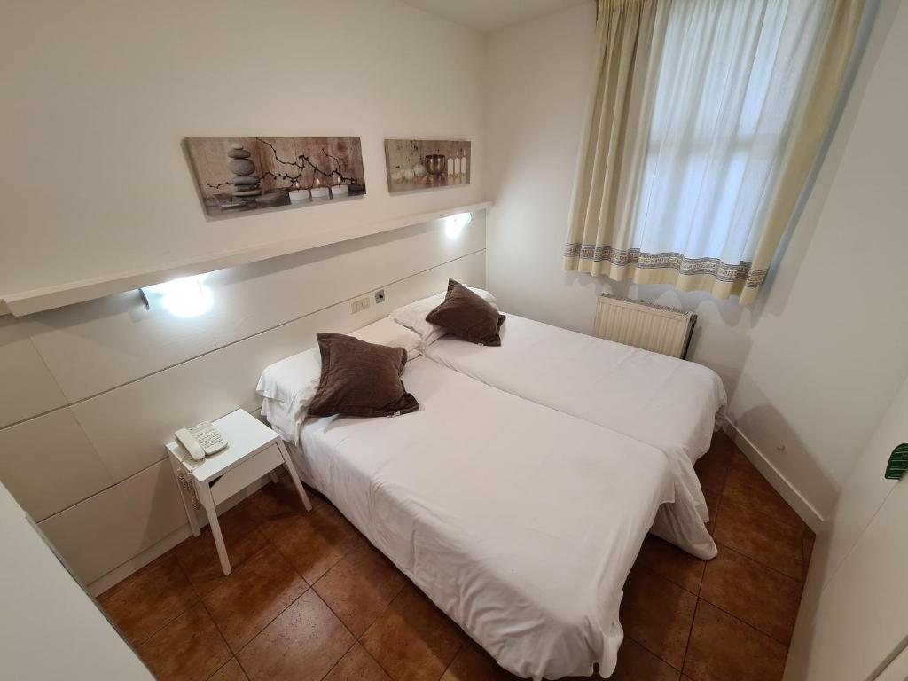 Postel nebo postele na pokoji v ubytování Hotel Jacobeo