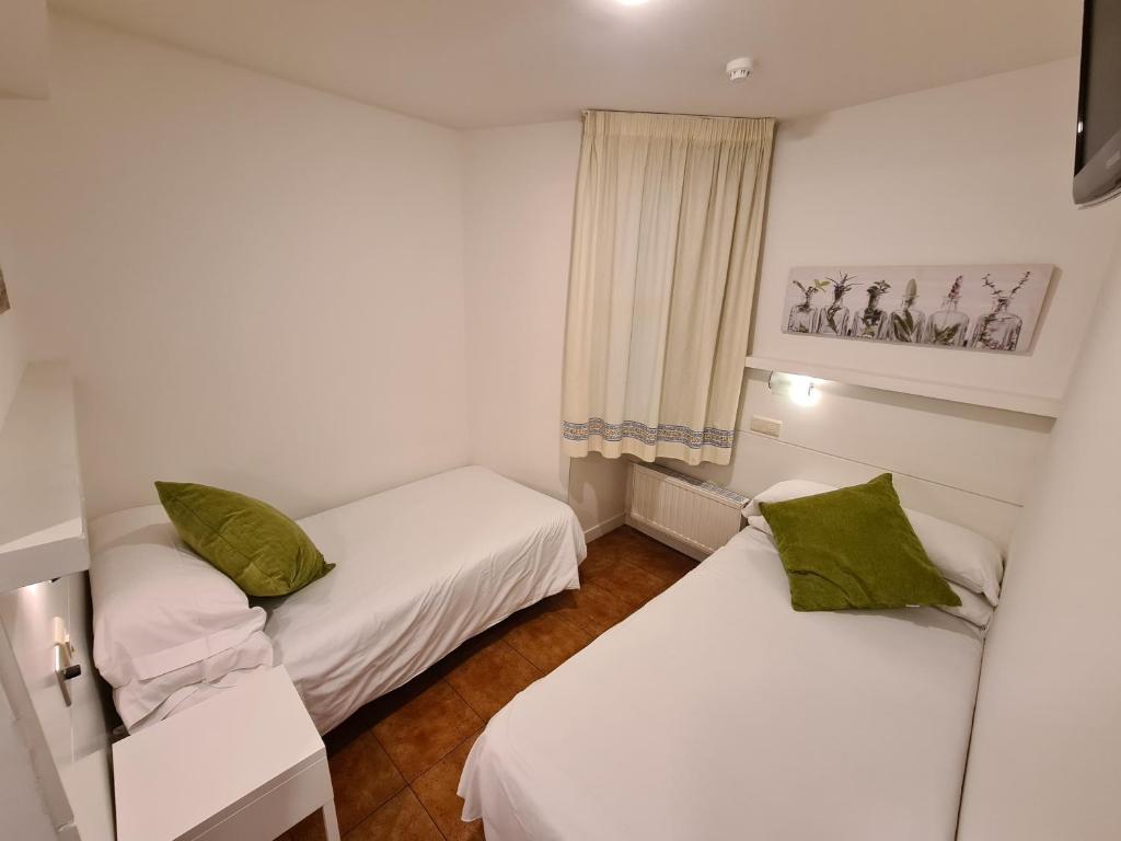 Postel nebo postele na pokoji v ubytování Hotel Jacobeo