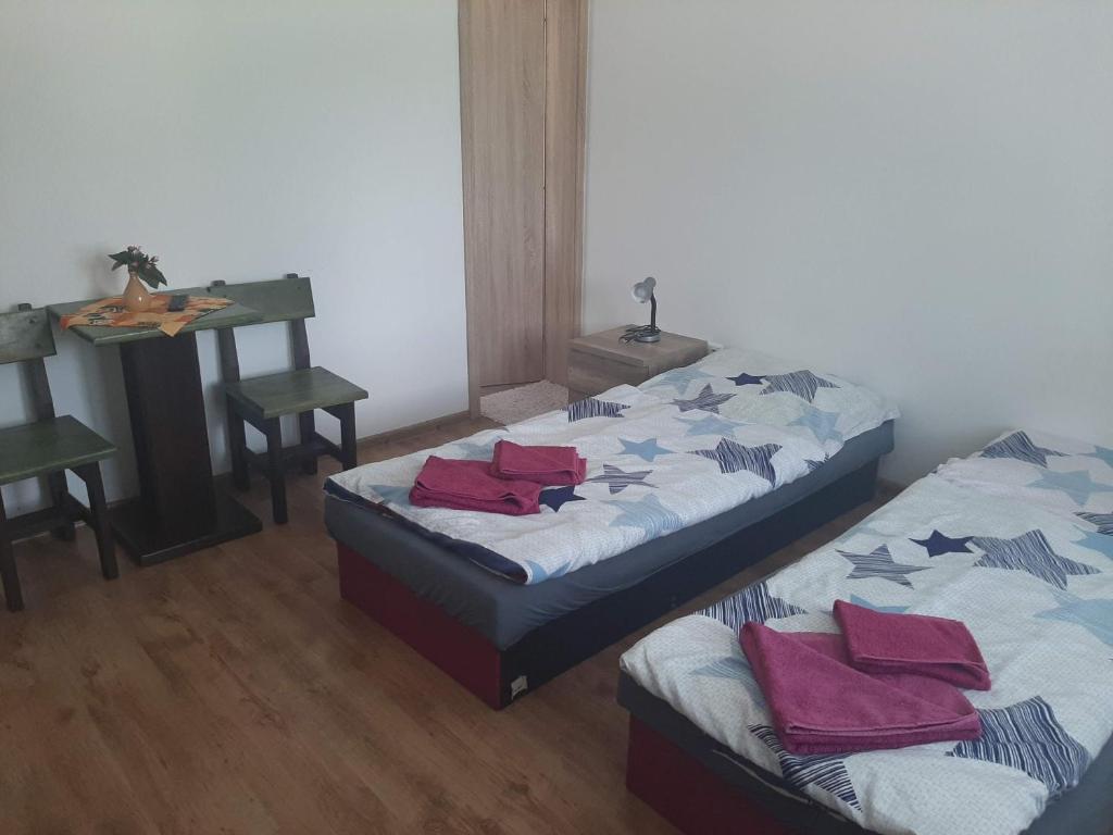 A bed or beds in a room at Ubytovanie Janka
