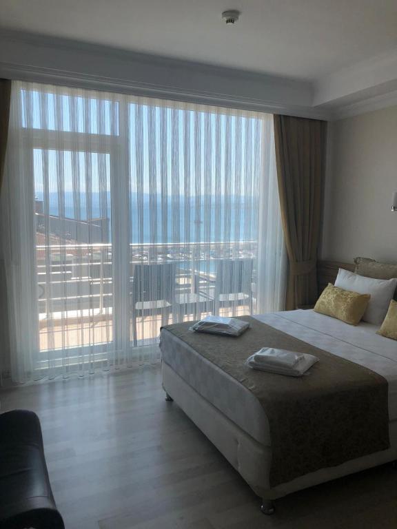 Postel nebo postele na pokoji v ubytování Sinopark Hotel