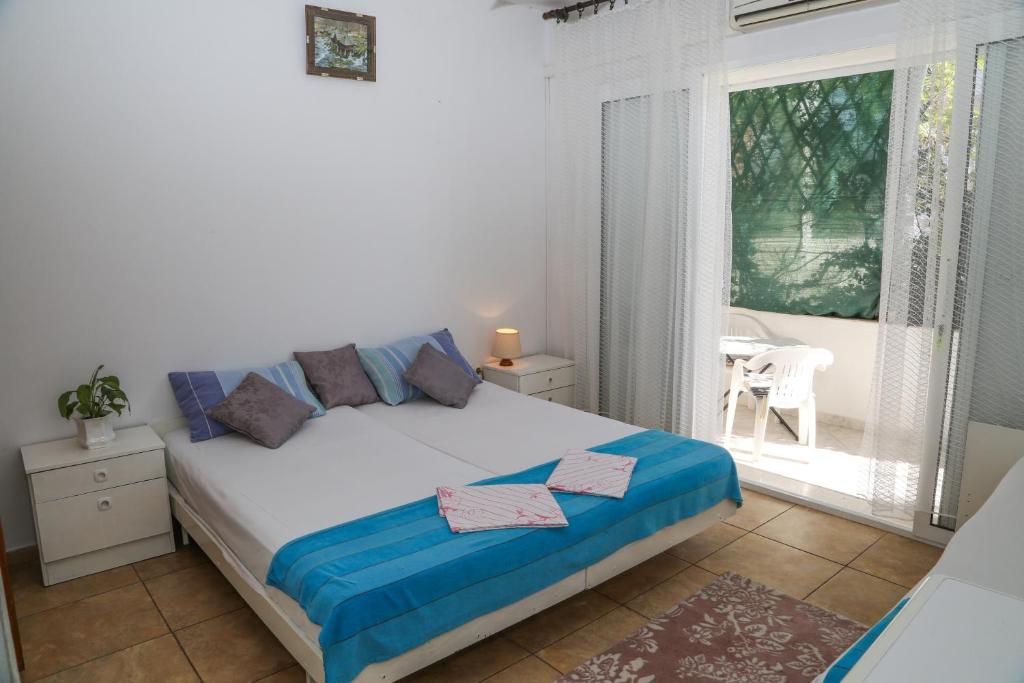 Postel nebo postele na pokoji v ubytování Apartments Butkovic