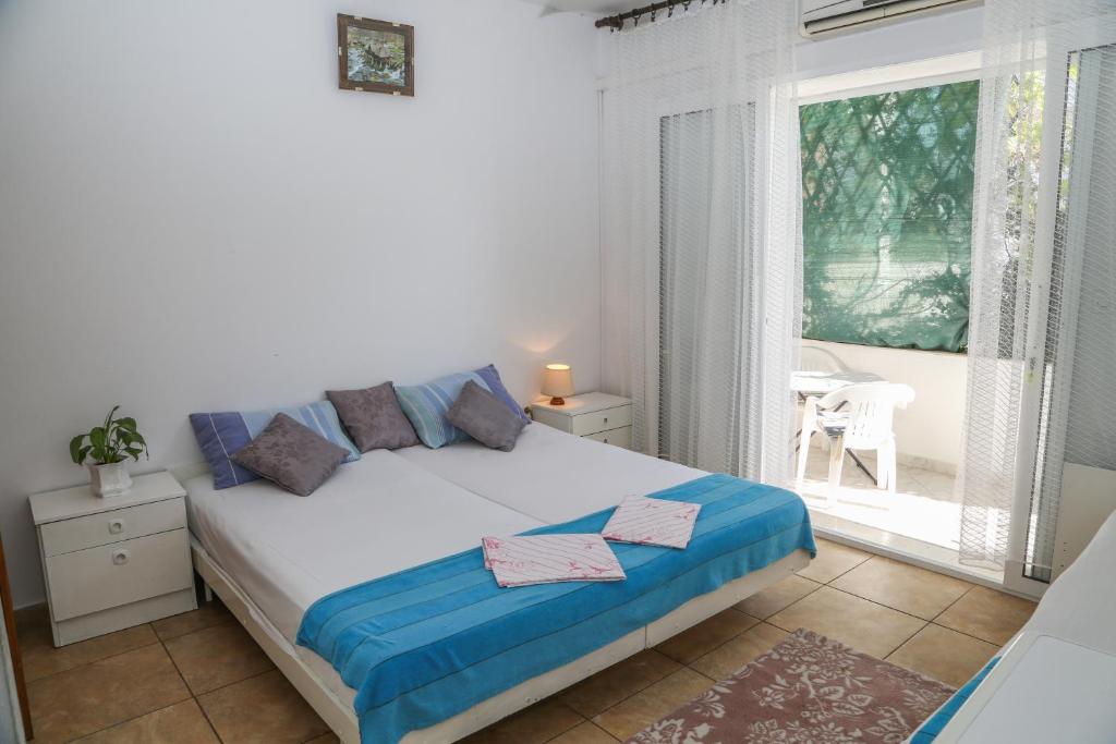 Postel nebo postele na pokoji v ubytování Apartments Butkovic